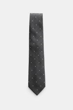 Top-down view of Tom Ford Silk tie dark grey/black/cream patterned with herringbone and polka dots, pure silk, subtle sheen, 8 cm wide.

Description: 
<p>Confident elegance down to the finest detail: This fine silk tie by TOM FORD is a stylish essential f