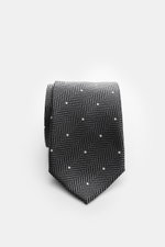 Tom Ford Seidenkrawatte dunkelgrau/schwarz/creme gemustert, Fischgrat mit Punkten, Logo-Stitching, reine Seide, 8 cm breit, Frontaufnahme.