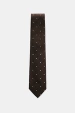 Tom Ford Seidenkrawatte dunkelbraun/schwarz/creme gemustert, Frontansicht, reine Seide, dezenter Glanz, Fischgratmuster mit Punkten, 8 cm breit, made in Italy, Logo-Stitching.