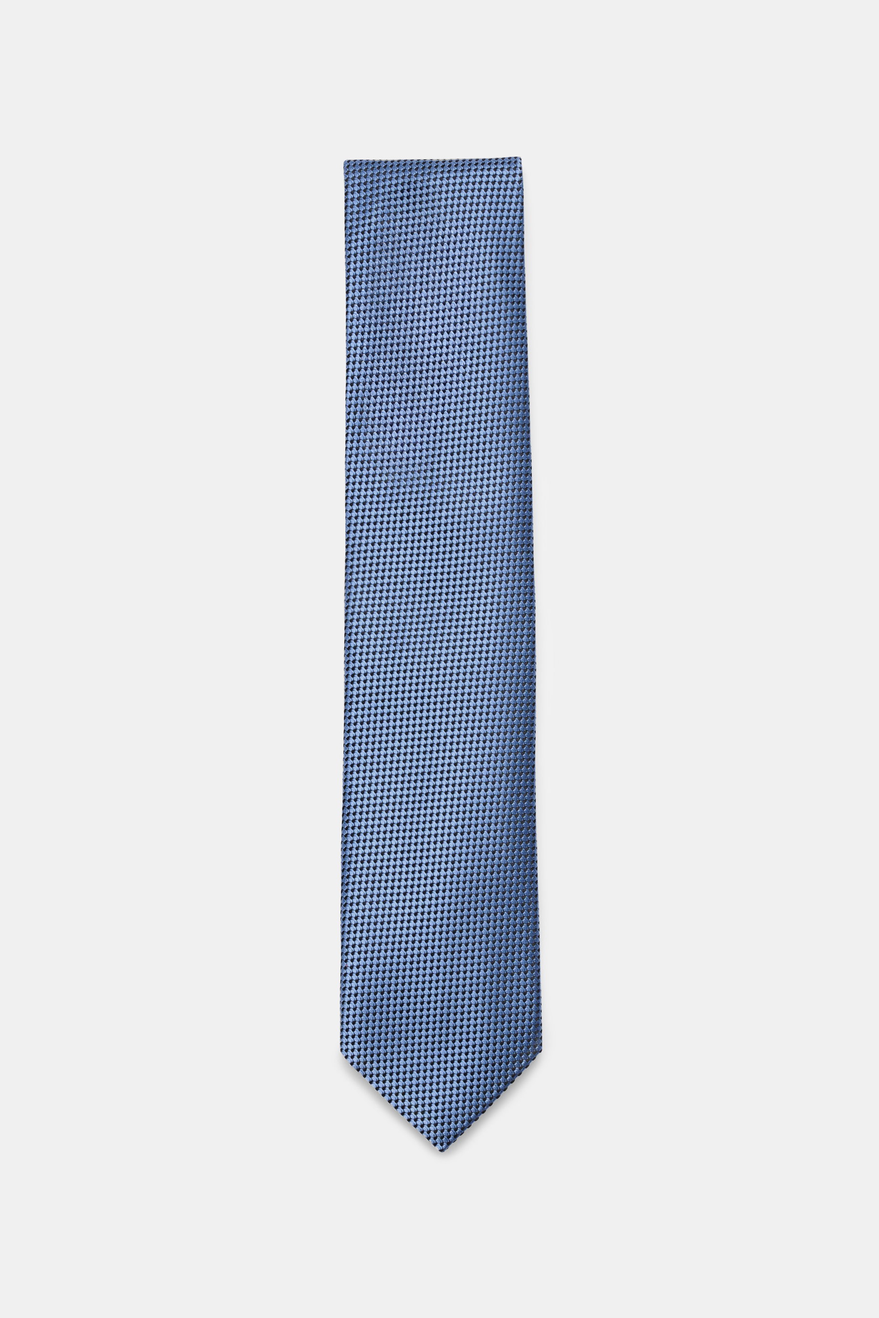 Front view of Tom Ford Silk Tie Smoke Blue/Black Patterned with timeless houndstooth pattern, subtle shine, pure silk, logo stitching, 8 cm width, made in Italy.  

<p>Luxurious Sophistication: The silk tie from TOM FORD adds an elegant touch to formal oc