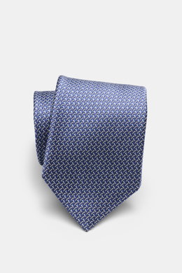 Tom Ford Seidenkrawatte rauchblau/creme gemustert, grafisches Muster mit dezentem Glanz, reine Seide, Logo-Stitching, 8 cm breit, made in Italy, nah von oben fotografiert.