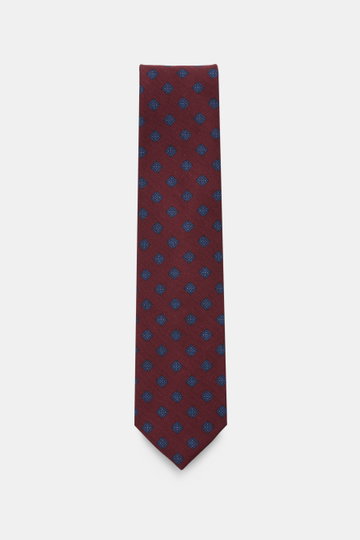 Cesare Attolini Krawatte 'Ventaglio' bordeaux/blau gemustert mit grafischem Muster, reine Wolle, Breite 8,5 cm, Made in Italy, frontal fotografiert.