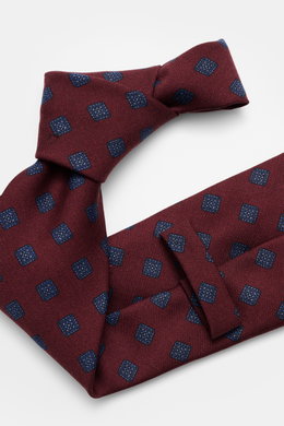 Cesare Attolini Krawatte 'Ventaglio' bordeaux/blau gemustert, reine Wolle, grafisches Muster, Made in Italy, Breite 8,5 cm, Nahaufnahme von oben.