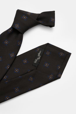 Nahaufnahme der von oben fotografierten Cesare Attolini Krawatte 'Ventaglio' anthrazit/navy/braun gemustert mit Medaillonmuster, Mix aus Wolle und Seide, Made in Italy, Breite 8,5 cm.