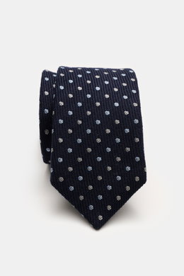 Nahaufnahme der Borrelli Krawatte navy/hellblau/creme gepunktet, handgefertigt in Italien aus Seide und Schurwolle mit klarer Webstruktur und zeitlosem Punkte-Design, fotografiert von oben.