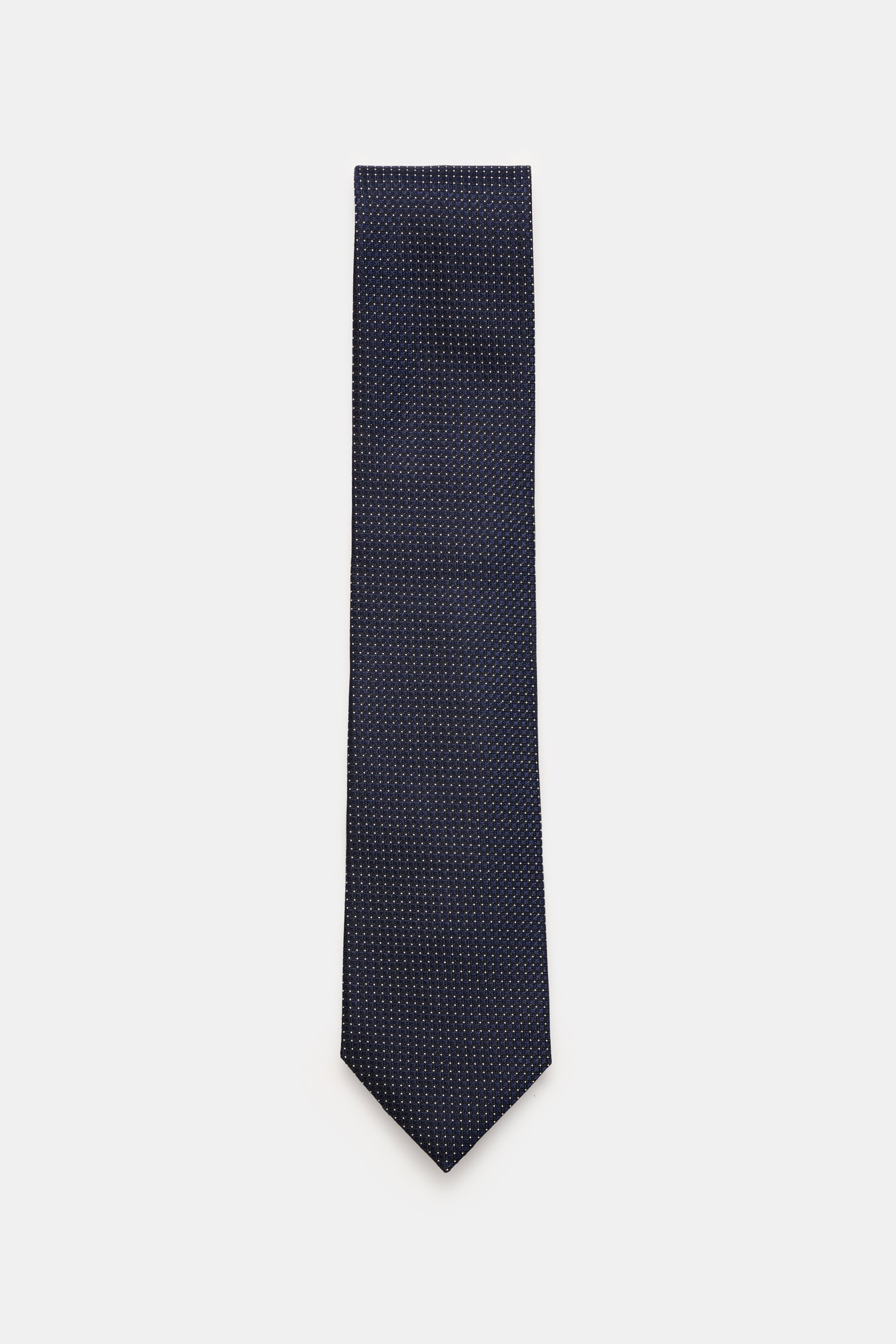 Zegna Seidenkrawatte navy/creme gemustert, frontal fotografiert, reine Seide, dezenter Glanz, grafisches Webmuster, kontrastfarbener Futterstoff, Made in Italy, ca. 8 cm breit.