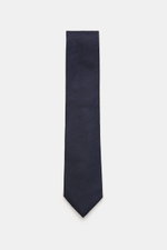 Zegna Seidenkrawatte navy/creme gemustert, frontal fotografiert, reine Seide, dezenter Glanz, grafisches Webmuster, kontrastfarbener Futterstoff, Made in Italy, ca. 8 cm breit.