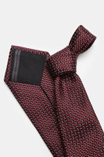 Zegna Silk tie burgundy/black/cream patterned shown from an angled top view, featuring pure silk, subtle shine, graphic pattern, made in Italy, width approx. 8 cm.