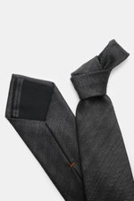 Zegna Tie dark grey shown from a top-down perspective, featuring a subtle striped pattern, mix of wool and silk, subtle shine, Made in Italy, width approx. 8 cm.