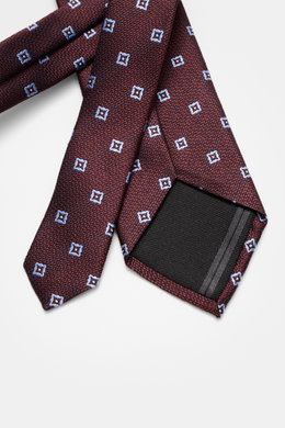 Zegna Seidenkrawatte schwarz/bordeaux/hellgrau gemustert, aus reine Seide mit feinem Webmuster, dezentem Glanz, monochromem Futterstoff, Made in Italy, ca. 8 cm breit, liegend von oben fotografiert.