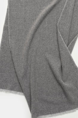 Close-up top-down view of the Brunello Cucinelli Cashmere Scarf grey/light grey patterned showing its classic herringbone woven design and narrow fringed edge.

Additional description:  
<p>Quiet-luxury label BRUNELLO CUCINELLI is known for its elegant, t