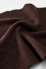 Close-up angled view of the Filippo de Laurentiis Bandana dark brown, showing its soft, voluminous texture and medium-fine knit pattern.

<p>This soft bandana by FILIPPO DE LAURENTIIS is knitted from a noble material composition and is a practically light