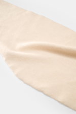 Smooth, soft Filippo de Laurentiis Bandana sand knitted scarf shown from a close-up top view, highlighting its voluminous, fine knit texture.

<p>This soft bandana by FILIPPO DE LAURENTIIS is knitted from a noble material composition and is a practically 