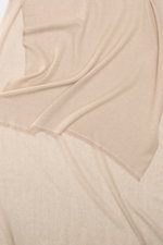 Altea Cashmere scarf beige shown from above, draped to display pure cashmere, very soft feel, fine lightweight quality, narrow fringed edge, dimensions approx. 192 cm x 65 cm.