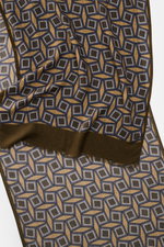 Close-up top-down view of the Altea Scarf dark brown/brown/grey blue patterned, featuring a graphic print with rolled edges and narrow fringed hem, made from a mix of wool and modal, smooth texture, lightweight quality, dimensions approx. 182 cm x 53 cm.