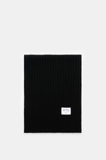 FTC Cashmere scarf black shown from above, flat on white background, rib knit pattern, large logo label visible.  
<p>An elegant, sustainably produced accessory for cold days: This scarf with rib knit pattern by FTC is made of luxurious, pure fair trade c