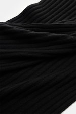Close-up front view of FTC Cashmere scarf black showing wide rib knit pattern and soft texture in black.

Description: 
<p>An elegant, sustainably produced accessory for cold days: This scarf with rib knit pattern by FTC is made of luxurious, pure fair tr