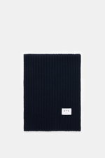 FTC Cashmere scarf navy shown from above, folded to display wide rib knit pattern, soft pure cashmere, and logo label.