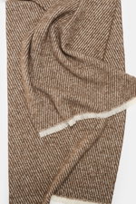 Top-down view of 04651/ A trip in a bag Scarf 'Fancy Twill' grey brown/cream showing coarse twill structure, narrow fringed edge, soft feel, mix of virgin wool, baby alpaca, microfiber, approx. 180 cm x 48 cm.