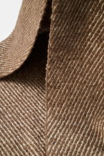 Close-up front view of 04651/ A trip in a bag Scarf 'Fancy Twill' grey brown/cream showing coarse twill structure, narrow fringed edge, soft feel from mix of virgin wool, baby alpaca, and microfiber, dimensions approx. 180 cm x 48 cm.