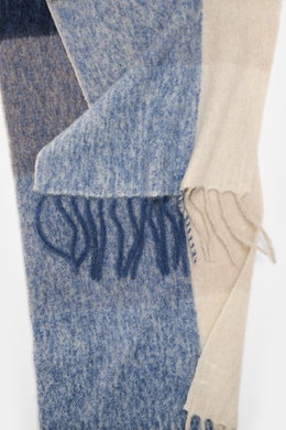 Close-up top view of 04651/ A trip in a bag Scarf 'Color Block Scarf' blue melange/beige/cream showing soft fringed hem and color block design.

Description: 
<p>Essential winter must-have: The noble scarf from 04651/ A TRIP IN A BAG becomes a favorite pi