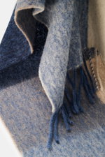 Close-up front view of 04651/ A trip in a bag Scarf 'Color Block Scarf' blue melange/beige/cream showing soft, fringed hem.

Additional description: 
<p>Essential winter must-have: The noble scarf from 04651/ A TRIP IN A BAG becomes a favorite piece for t