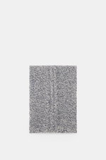 Top view of the 04651/ A trip in a bag Scarf offwhite/navy melange showing coarse and cable knit patterns, mix of virgin wool and cashmere, soft touch, approx. 164 cm x 30 cm, winter casualness completing sophisticated looks with warmth.