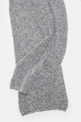 Top view of the 04651/ A trip in a bag Scarf offwhite/navy melange, showing coarse and cable knit patterns in a soft mix of virgin wool and cashmere, approx. 164 cm x 30 cm, styled for winter casualness with a pleasant warmth.