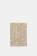 Top view of 04651/ A trip in a bag Scarf cream/beige melange showing coarse and cable knit patterns in a soft virgin wool and cashmere mix.

Description: <p>Winter casualness: The scarf by 04651/ A TRIP IN A BAG stylishly completes sophisticated looks wit
