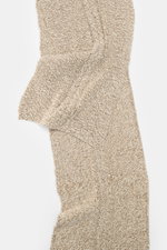 Top-down view of 04651/ A trip in a bag Scarf cream/beige melange with coarse and cable knit patterns in virgin wool and cashmere.

Description: 
<p>Winter casualness: The scarf by 04651/ A TRIP IN A BAG stylishly completes sophisticated looks with a soft