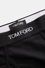 Nahaufnahme aus schräger Perspektive des elastischen Bundes vom Tom Ford Sport Slips 2er-Set schwarz/graugrün mit TOM FORD-Stitching, seitlichem Eingriff, Slim Fit, elastischer Baumwolle und weichem Griff.