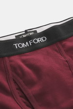 Tom Ford Boxershorts 2er-Set navy/bordeaux, Nahaufnahme seitlich von oben, Slim Fit, reine Baumwolle, glatter Griff, elastischer Bund mit TOM FORD-Stitching, seitlicher Eingriff, sportlich, schlicht und luxuriös.