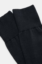 Close-up image of the top cuff section of the Falke Sock 'No. 6' dark navy, photographed from above, showing the fine knit texture and elasticated wide bands. With the 'No. 6' sock, FALKE shows how luxurious comfort can be: The finest Australian merino wo