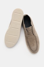 Officine Creative Loafer 'Herbie' taupe shown from above, one shoe top view with smooth velour leather, narrow silhouette, decorative seam, grosgrain loop, leather lining, and flexible rubber sole visible on the other shoe.