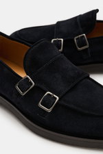 Officine Creative Penny Loafer 'Opera Flexi 101' dunkelbraun shown from a close-up side and top angle, featuring smooth dark brown velour leather, a slightly tapered silhouette, Goodyear welted construction, decorative stitching on the toe cap, a classic 