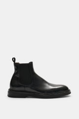 Side view of Officine Creative Chelsea Boot 'Dude Flexi' black in polished smooth leather, Goodyear welted with tapered silhouette and elastic inserts.