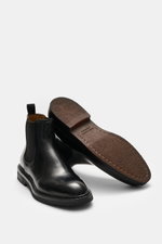 Officine Creative Chelsea Boot 'Dude Flexi' black shown from side and sole views, polished leather with Goodyear welted frame.

Description: <p>Move versatilely through autumn and winter with the Chelsea Boot 'Dude Flexi' by OFFICINE CREATIVE, combining a