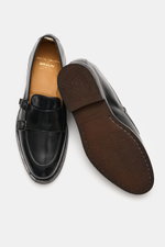Officine Creative Double Monk 'Opera Flexi' black shoes shown from top and sole views, smooth leather, double monk strap, tapered silhouette.