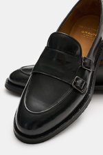 Close-up angled view of Officine Creative Double Monk 'Opera Flexi' black shoe in noble smooth leather with double monk strap and decorative toe stitch.

Description: <p>Keep stylishly in step with the Monk 'Opera Flexi' from OFFICINE CREATIVE. It is a cl