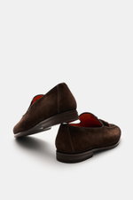 Santoni Suede Tassel Loafer 'Carter' brown shown from a rear side angle, featuring soft suede leather, narrow tapering silhouette, front cap with decorative seam, typical tassel, leather lining, flexible rubber sole, and rubber heel reinforcement.