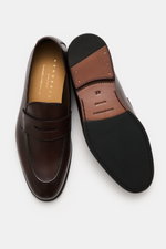 Henderson Penny Loafer 'Moro' dark brown shown from top and sole views, made of supple leather with penny strap, stitching, Goodyear welt, leather lining, rubber outsole, and reinforced heel.