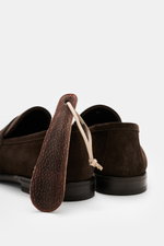 Rear view of Henderson Penny Loafer 'Moro' dark brown in supple suede leather with leather lining, rubber outsole, Goodyear-welted, narrow tapered silhouette, typical penny strap, decorative front seam, heel with rubber reinforcement, and a practical shoe