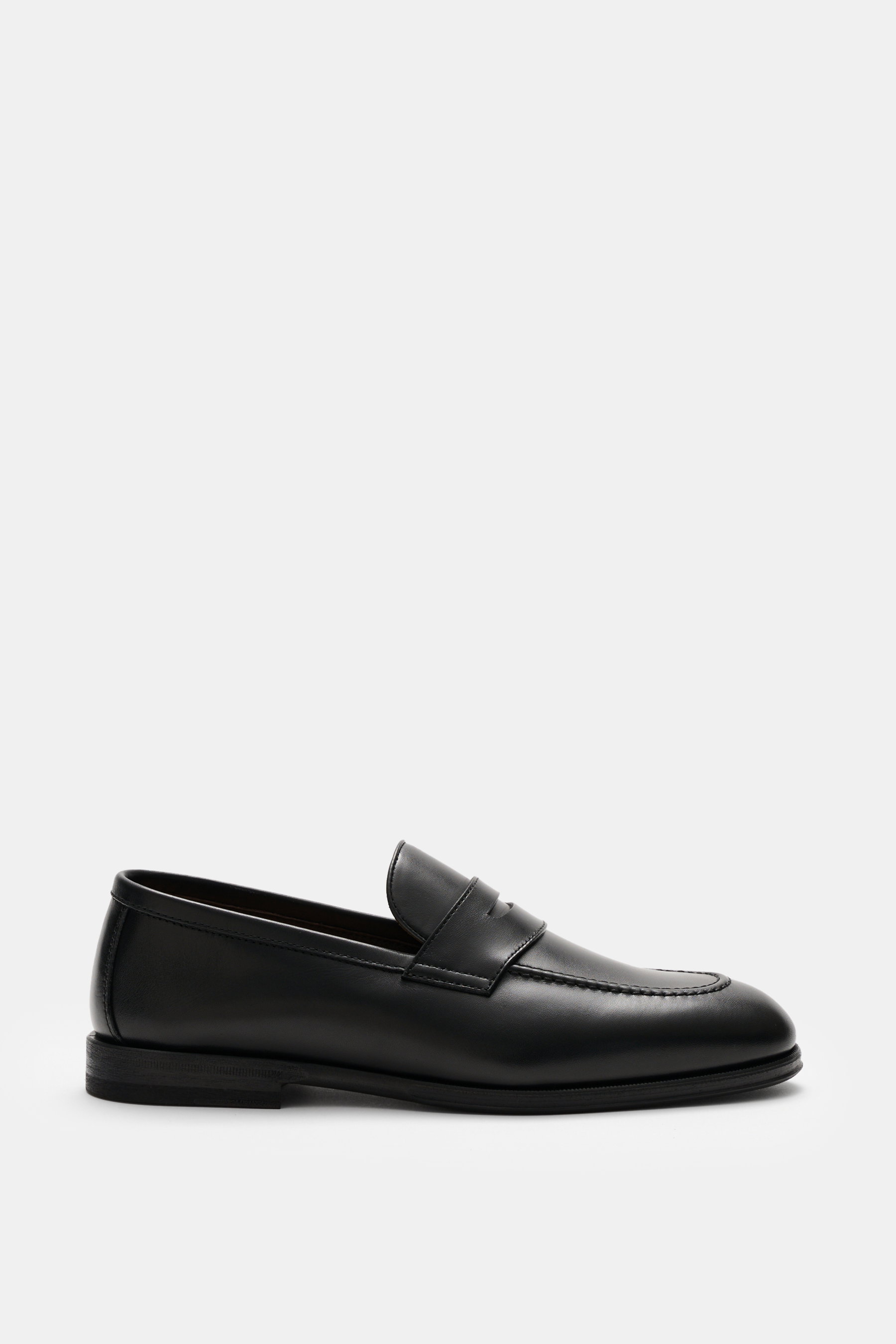 Henderson Penny Loafer 'Royal' black shown from side view, made of finely grained leather with typical penny strap, narrow tapering silhouette, decorative stitching on toe cap, Goodyear-welted, leather lining, rubber outsole, and heel with rubber reinforc