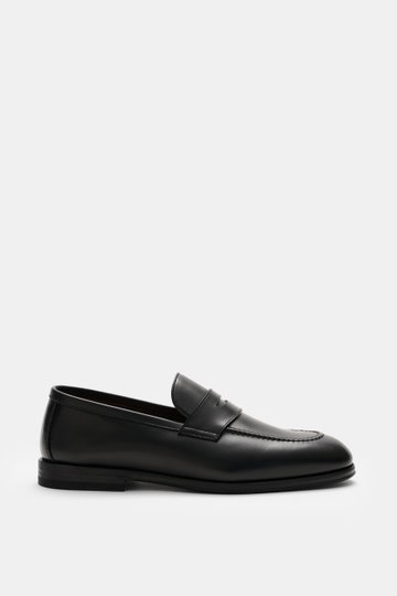 Henderson Penny Loafer 'Royal' black shown from side view, made of finely grained leather with typical penny strap, narrow tapering silhouette, decorative stitching on toe cap, Goodyear-welted, leather lining, rubber outsole, and heel with rubber reinforc