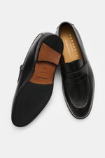 Top view of Henderson Penny Loafer 'Royal' black showing supple finely grained leather, typical penny strap, narrow tapering silhouette, decorative toe stitching, Goodyear-welted construction, leather lining, rubber outsole, and heel with rubber reinforce