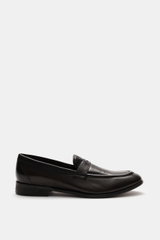 Side view of Sturlini Penny loafers 'Bufalo' dark brown in fine smooth leather with tapered silhouette, penny strap, topstitching, and leather-rubber outsole.