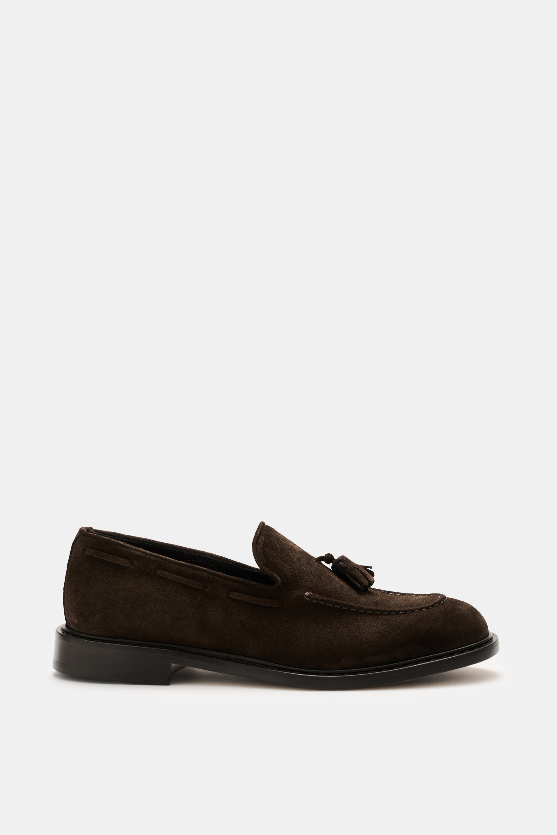 Side view of Sturlini Suede tassel loafer 'Crosta Piuma' dark brown, noble suede leather, slightly tapered silhouette, typical tassel detail, distinctive topstitching on toe cap, leather lining, Blake construction, leather and rubber outsole.