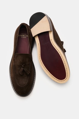 Top-down view of Sturlini Suede tassel loafer 'Crosta Piuma' dark brown showing noble suede leather, slightly tapered silhouette, typical tassel detail, distinctive topstitching on the toe cap, leather lining, Blake construction, and leather and rubber ou