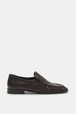 Side view of The Row Loafer dark brown in soft eel leather with typical strap, grained look, narrowing silhouette, and decorative seam on front cap.

Description: <p>Highest comfort from master craftsmanship: This loafer by THE ROW is handcrafted in Italy