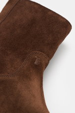 Tod's Ankle boot dark brown close-up from above showing noble suede leather, slightly slim tapering silhouette, side zipper, high shaft, leather lining, and lightly profiled rubber sole.